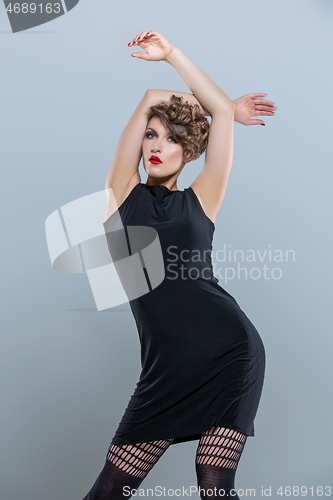 Image of girl in small black dress