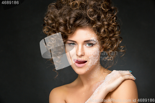 Image of beautiful girl with curly hairdo