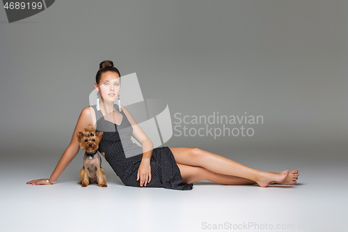 Image of Girl with yorkie dog