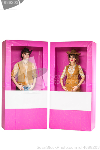 Image of boy and girl dolls in box