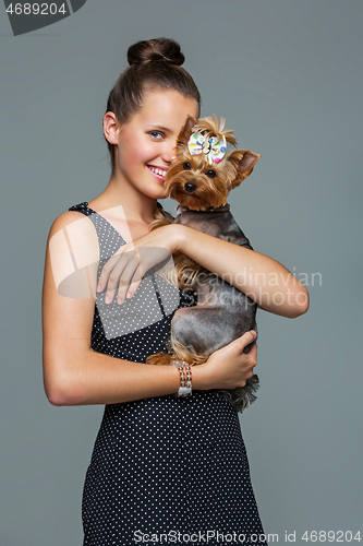 Image of Girl with yorkie dog