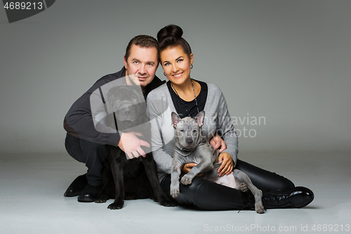 Image of couple with two dogs