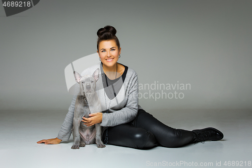 Image of girl with thai ridgeback puppy