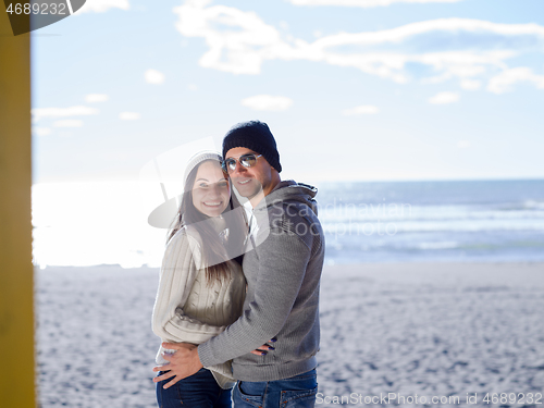 Image of Couple chating and having fun at beach bar