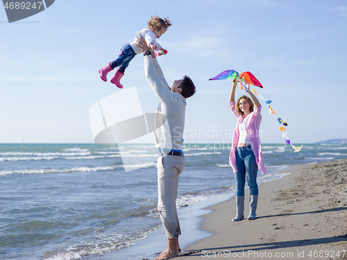 Image of happy family enjoying vecation during autumn day