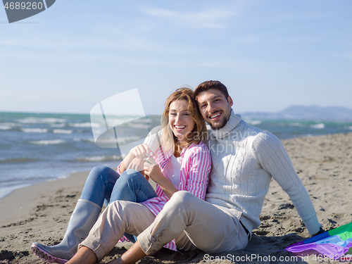 Image of young couple enjoying time together at beach