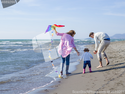 Image of happy family enjoying vecation during autumn day