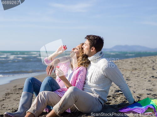 Image of young couple enjoying time together at beach