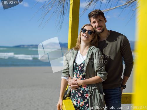 Image of Couple chating and having fun at beach bar