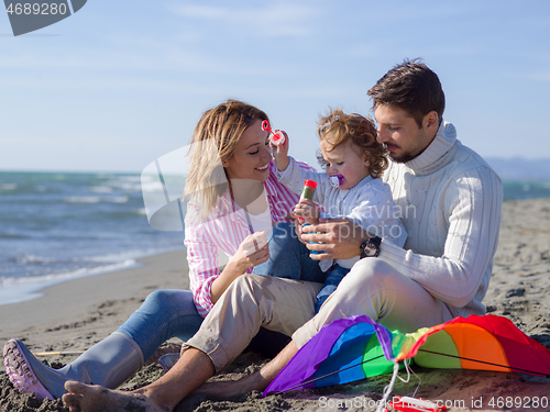 Image of Young family enjoying vecation during autumn day