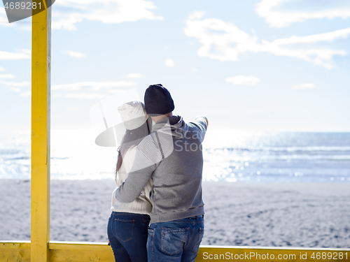 Image of Couple chating and having fun at beach bar