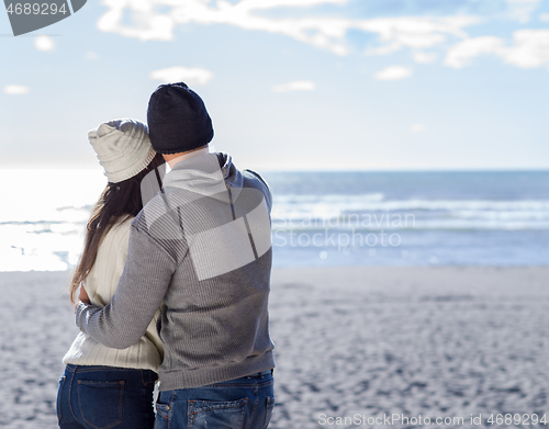 Image of Couple chating and having fun at beach bar