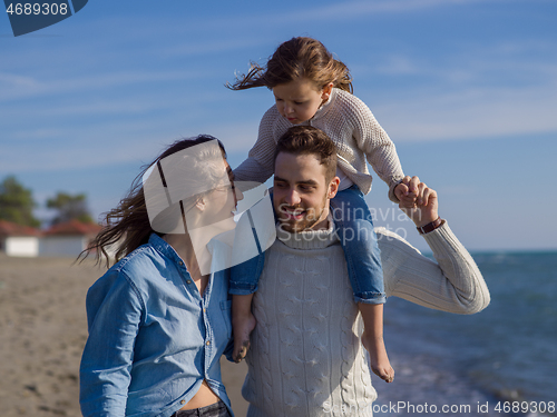 Image of Young family enjoying vecation during autumn day