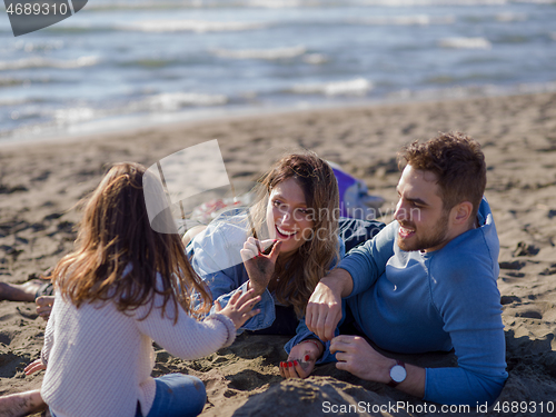 Image of Young family enjoying vecation during autumn day