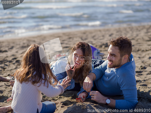 Image of Young family enjoying vecation during autumn day