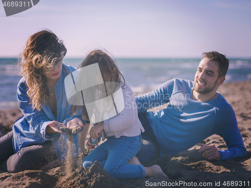 Image of Young family enjoying vecation during autumn day