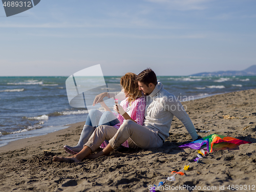 Image of young couple enjoying time together at beach