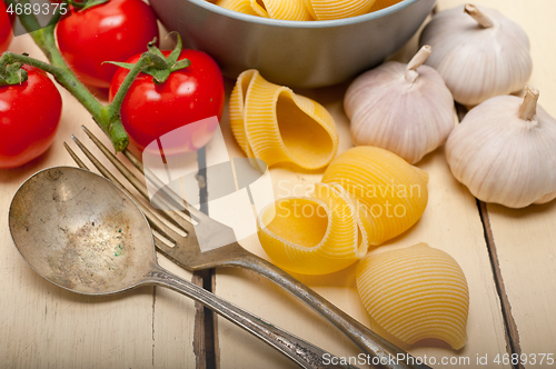 Image of Italian snail lumaconi pasta with tomatoes