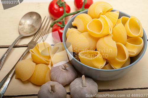 Image of Italian snail lumaconi pasta with tomatoes