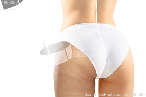Image of Overweight woman with fat cellulite legs and buttocks, obesity female body in white underwear comparing with fit and thin body isolated on white background