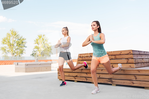 Image of women training and doing split squats