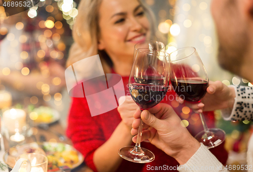 Image of close up of friends with wine celebrate christmas