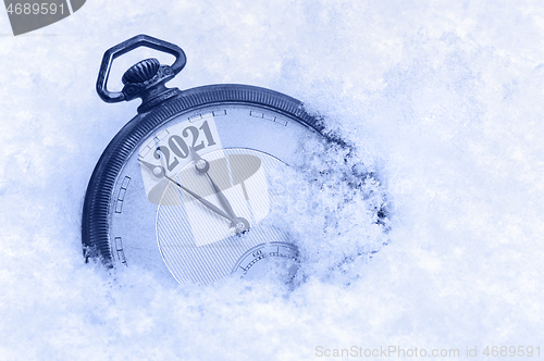 Image of New Year 2021 greeting card, 2021 new year, pocket watch in snow, happy new year concept, countdown to midnight