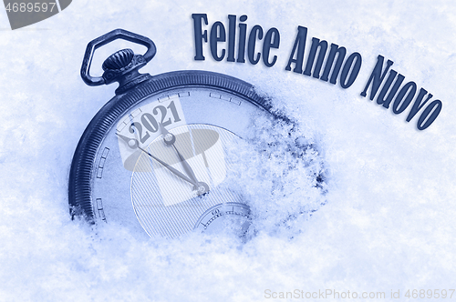 Image of New year 2021, Happy New Year 2021 greeting in Italian language, Felice Anno Nuovo text, countdown to midnight