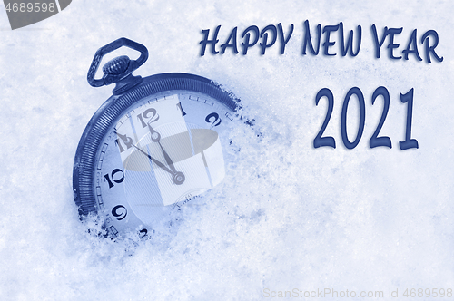 Image of Happy new year card, New Year 2021 greeting in English language, pocket watch in snow, happy new year 2021 text, countdown to midnight