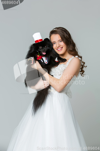 Image of bride girl with spitz goom in wedding suit