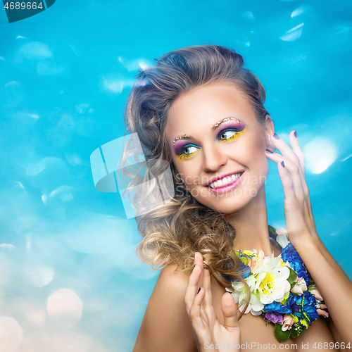 Image of beautiful girl with flower accessories