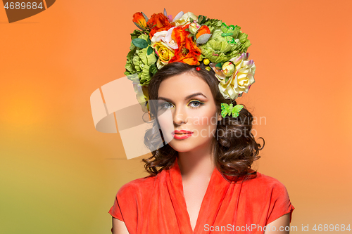 Image of beautiful girl in orange dress