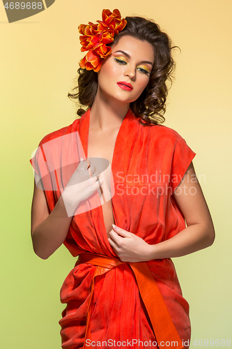 Image of beautiful girl in orange dress