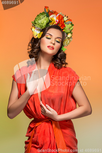 Image of beautiful girl in orange dress