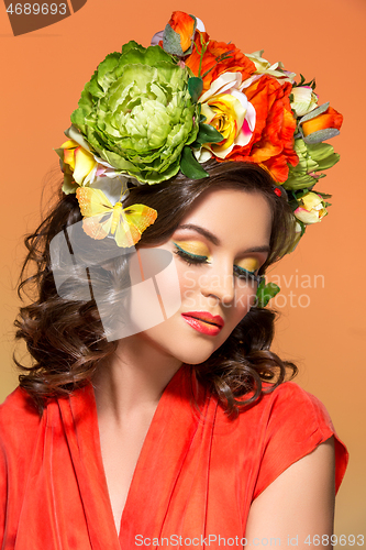 Image of beautiful girl in orange dress