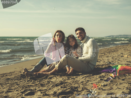 Image of Young family enjoying vecation during autumn day