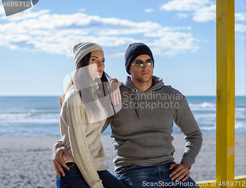 Image of Couple chating and having fun at beach bar