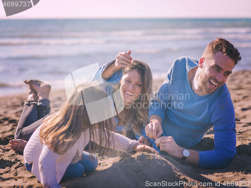 Image of Young family enjoying vecation during autumn day