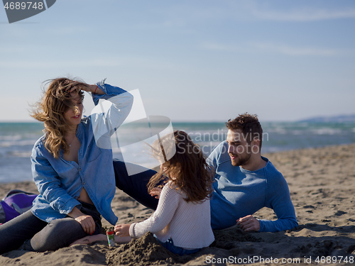 Image of Young family enjoying vecation during autumn day