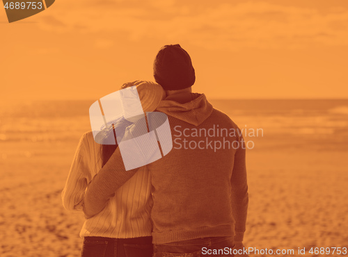 Image of Couple chating and having fun at beach bar