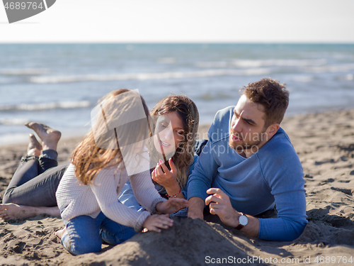 Image of Young family enjoying vecation during autumn day