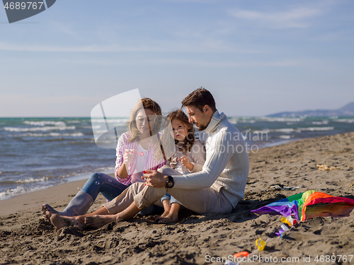 Image of Young family enjoying vecation during autumn day