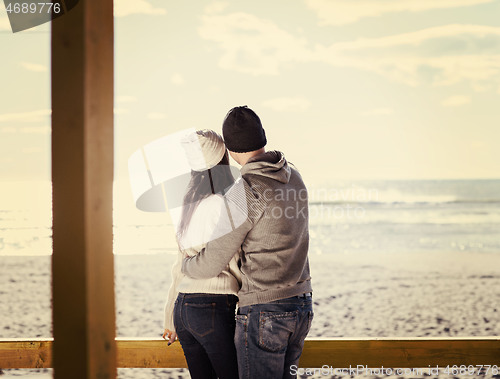 Image of Couple chating and having fun at beach bar