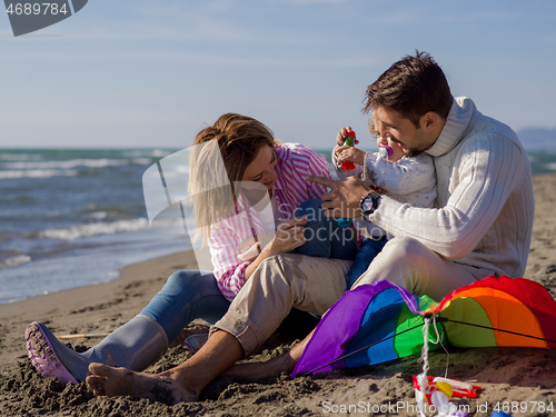 Image of Young family enjoying vecation during autumn day