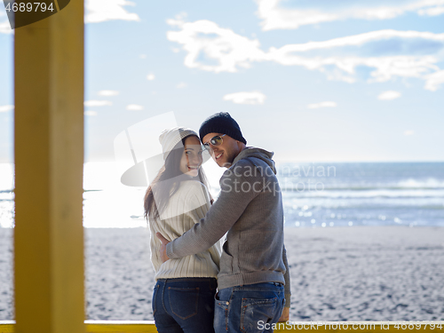 Image of Couple chating and having fun at beach bar