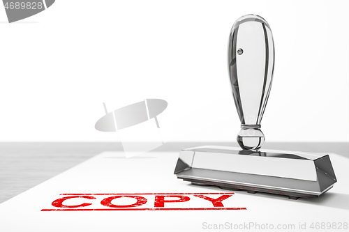 Image of red copy stamp on white paper background