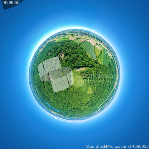 Image of little planet rural fields and forest south Germany