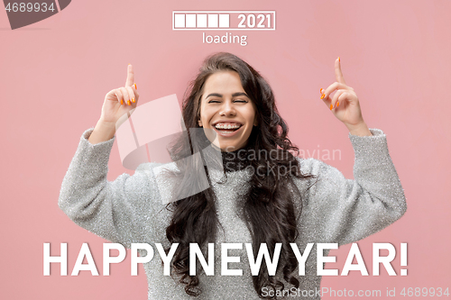 Image of Caucasian young woman\'s portrait isolated on pink studio background, celebrating New 2021 Year and Christmas