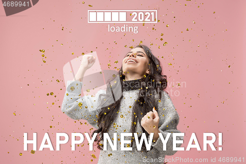 Image of Caucasian young woman\'s portrait isolated on pink studio background, celebrating New 2021 Year and Christmas