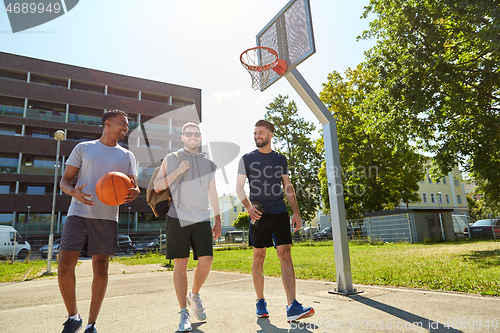 Image of group of male friends going to play basketball